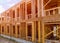 Close-up new stick built home under construction under blue sky Framing structure wood frame of wooden houses home