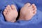 Close up of newborn baby feet. Baby. Cozy. Family