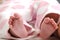 Close-up of newborn baby girl feet