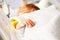 Close-up of newborn fingers in hospital crib bed