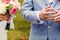 A close-up of newlyweds hands with rings