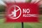 Close-up of the no alcohol sign in motion blur in the park near residential area