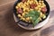 Close-up of nutritious chickpeas with codfish and sausage on plate.Fork and spoon.