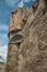 Close-up o stone wall and watch-tower of the Gravensteen Castle in Ghent.