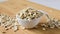 close-up, oatmeal in a white bowl on a wooden plank