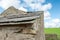 Close-up of an old and abandoned farmer`s croft building showing its run down condition.