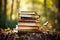 Close-up old books with dry leafy branch next to forest background, stacked. Generative ai