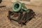 Close-up of old bronze cannon in the inner courtyard of the Les Invalides Palace in Paris.