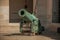 Close-up of old bronze cannon in the inner courtyard of the Les Invalides Palace in Paris.