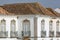 Close-up on an old building with roofs designed with an oriental style and wrought iron railing balconies, Tavira, Algarve