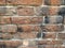 Close up of old clay brickwork wall
