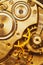 Close-Up Of Old Clock Watch Mechanism. Retro Clockwork Watch With Golden Gearwheels Gears. Vintage Movement Mechanics