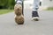 close up of old dirty shoes trainers, walking in a park