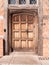 Close up of old medieval brown wooden retro door closed