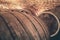 Close-up. Old oak barrels in an ancient wine cellar.