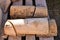 Close up of old roof tiles in two rows and all tiles are broken. The ancient tiles are stained with dust and lichens to reform an