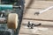 Close-up of an old skateboard wheel lying waiting for repairs on a wooden table in the garden on a sunny day