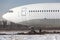 Close up of old unused large passenger plane on a snowy field