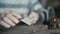 Close up of old wrinkled hands hewing his handmade wooden spoon 4K