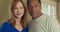 Close up of older Caucasian and African American couple standing in their home