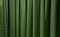 close up olive green curtains use as background. sack cloth texture drape for minimal interior design.