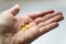 Close up omega 3 vitamin capsule in hand. capsule fish oil in hand.