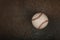 Close up one baseball ball on dark background