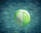 Close-up one bright green beach ball in swimming pool sunny day