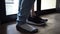 Close up of one person\'s feet walking inside the house without taking shoes off