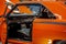 Close Up Of Open Door Of Orange Classic Car