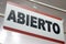 Close-up of an open sign in spanish. `Abierto`