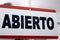 Close-up of an open sign in spanish. `Abierto`