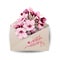 Close up of opened craft paper envelope full of spring blossom sacura flowers on white background. top view. Concept of