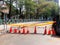 Close up of orange construction cones with yellow warning tape at road construction site in Taiwan