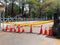 Close up of orange construction cones with yellow warning tape at road construction site in Taiwan