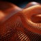 a close up of an orange mesh fabric on a black background