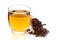 Close-Up of organic boiled water Tea or kada  of  clove syzygium aromaticum  in a transparent glass cup over white background