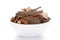 Close-up of Organic cinnamon  Cinnamomum verum or dalchini on a ceramic white bowl. Pile of Indian Aromatic Spice.