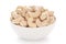 Close-up Organic dry fruit cashew nut Anacardium occidentale  in white ceramic  bowl on white background