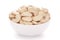 Close-up Organic dry fruit cashew nut Anacardium occidentale  in white ceramic  bowl on white background