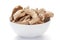 Close-up of Organic dry Ginger root Zingiber officinale or sonth on a ceramic white bowl. Pile of Indian Aromatic Spice.