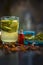 Close up of organic face pack of cucumber with aloe vera gel and rose oil on wooden surface in a glass container for Sunburns and