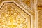 Close-up of ornate gilded golden ceiling