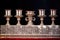 close-up of an ornate silver menorah on a polished podium