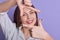 Close up ortrait Caucasian beautiful happy young woman wearing white shirt, charming female standing and making creativity