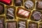 Close-up overhead shot of a box of milk chocolates - flat lay view from directly above