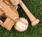 Close up overhead view of old baseball equipment on grass