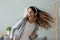 Close up overjoyed woman wearing headphones dancing, listen to music