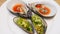 Close-up of Oysters and Mussels on a White Plate. Luxury Seafood in Restaurant