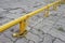 Close up of the padlock and iron chain painted in yellow old condition on the floor